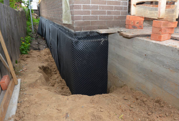 SJ Waterproofing Pros technician performing targeted Exterior Waterproofing assessment in Oxford, OH
